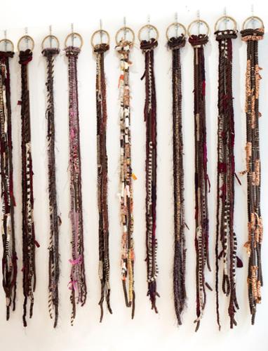 Theda Sandiford:  Ponytail & Door Knocker Earrings, Cotton rope and mixed media yarn, trim beads, eyelash yarn and bamboo, 6’x 6"x 4"

$800 plus tax for 1 rope
$2,100 plus tax for 3 ropes
$8 500 plus tax for the wall (12 ropes)